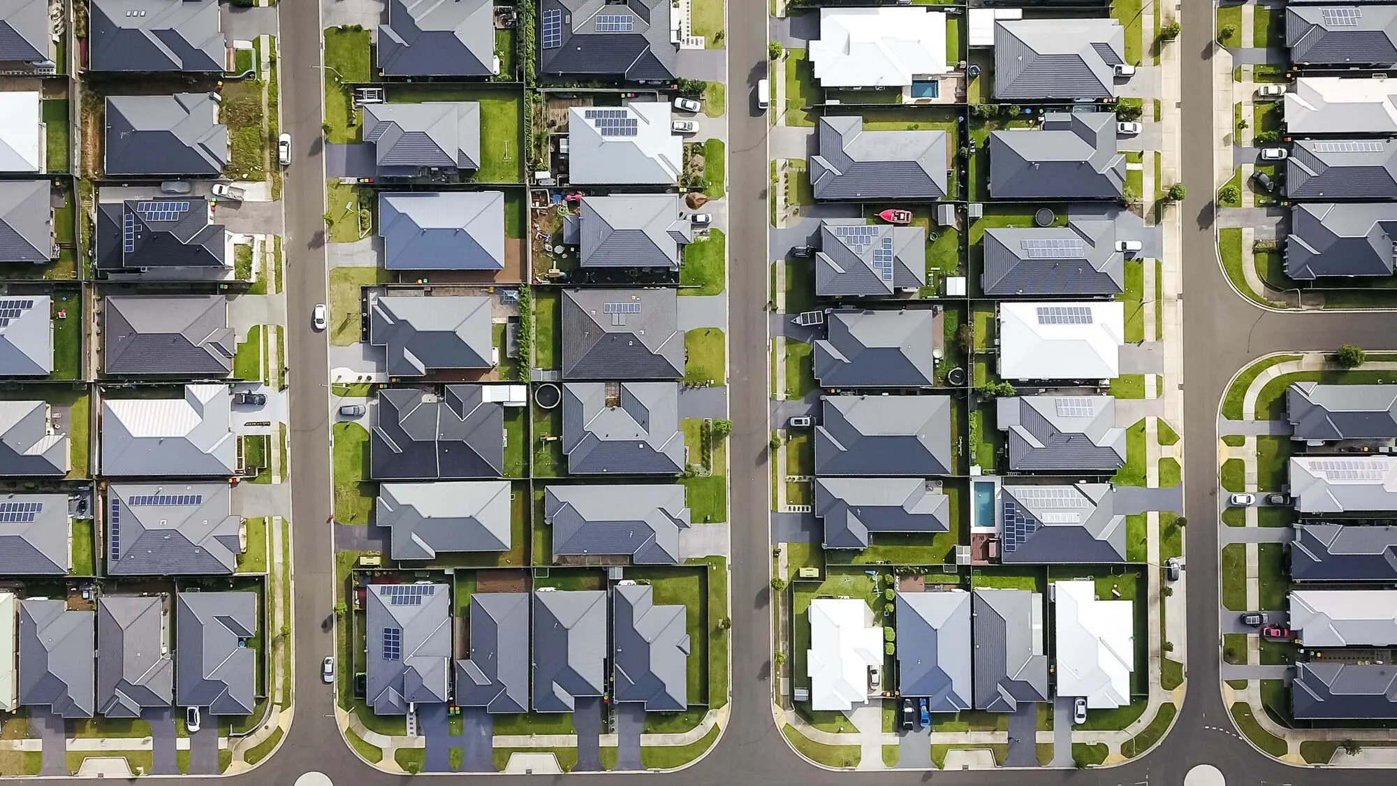 Suburban neighborhood in Naples, FL with rows of homes, green lawns, and neat streets—an area served by TN Capital Investments.