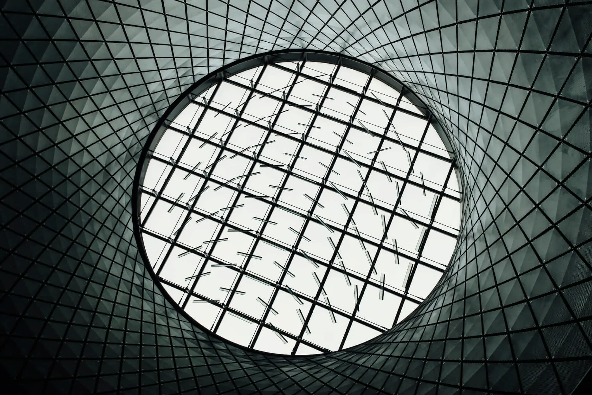 Circular skylight with grid and diamond tiles on ceiling, part of TN Capital Investments' completed projects in Naples, FL.